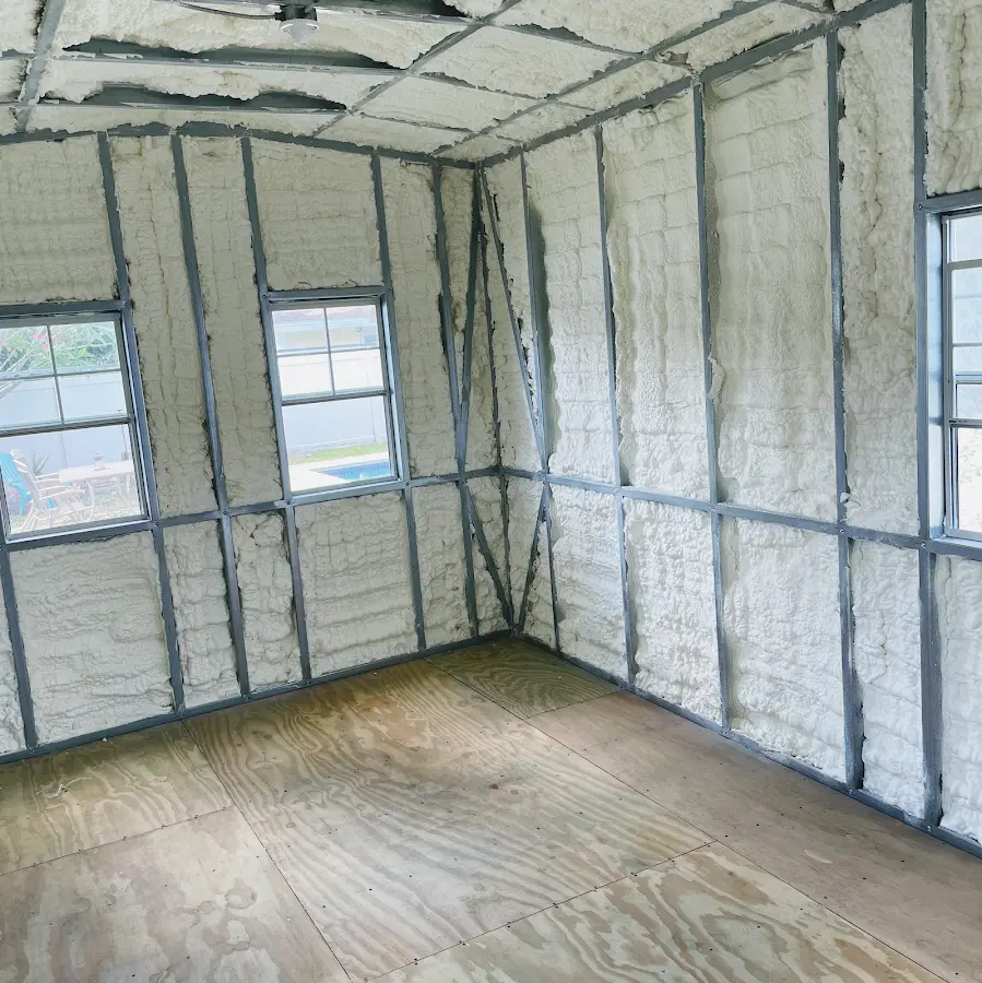 Closed-cell spray foam insulation applied to wall cavities in a residential project in Wolcott